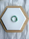 Dreamy Jade natural jadeite ring featuring a smooth polished band with translucent white and emerald green hues.