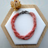 Dreamy Jade triple-strand pink gemstone beaded bracelet with a silver-tone infinity clasp and pavé crystals.