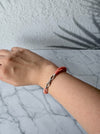 Dreamy Jade triple-strand pink gemstone beaded bracelet with a silver-tone infinity clasp and pavé crystal accents.