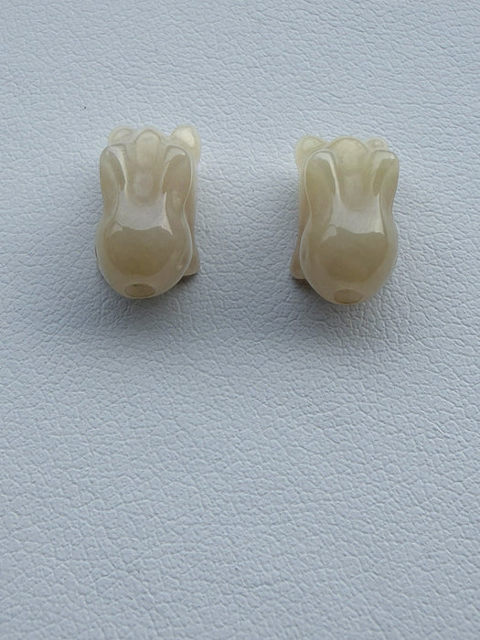Dreamy Jade hand-carved off-white rabbit beads with a smooth polished finish for jewellery making