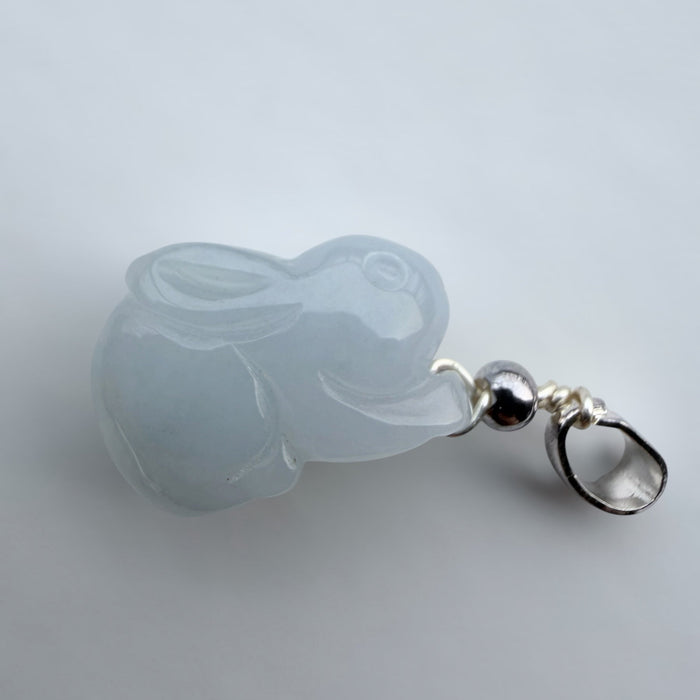 Dreamy Jade rabbit pendant carved from translucent light grey jade with a polished silver-tone bail.