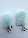 Dreamy Jade rabbit pendants in translucent green jade with rose gold and silver pavé-set stone bails.