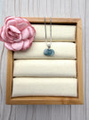 Dreamy Jade elegant rose-carved green jade pendant on a silver box chain displayed in a wooden jewellery tray