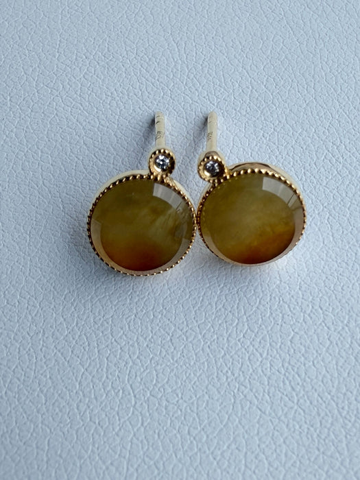 Dreamy Jade round stud earrings featuring warm-toned polished jade stones in gold-tone settings with sparkling accents.