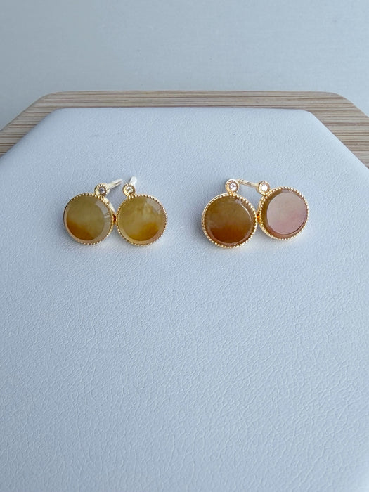Dreamy Jade round stud earrings featuring warm-toned jade stones in gold-tone settings with sparkling accent stones.