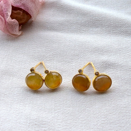 Dreamy Jade round stud earrings featuring warm-toned jade stones in gold-tone settings with sparkling accent stones.