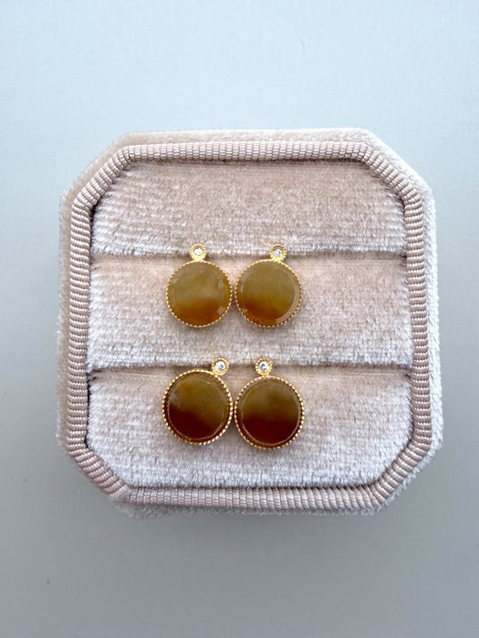 Dreamy Jade round stud earrings featuring warm-toned jade stones in gold-tone settings with sparkling accent crystals.