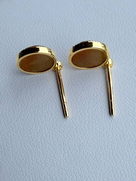 Dreamy Jade round stud earrings featuring warm-toned jade stones in gold-tone settings with a textured beaded edge.