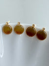 Dreamy Jade round stud earrings featuring warm-toned jade stones in gold-tone settings with sparkling accent crystals.