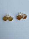 Dreamy Jade round stud earrings featuring warm-toned polished jade stones in gold-tone settings with sparkling accents.