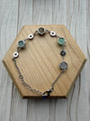 Dreamy Jade sterling silver bracelet featuring multi-coloured jade stones and intricate coin-inspired silver charms.